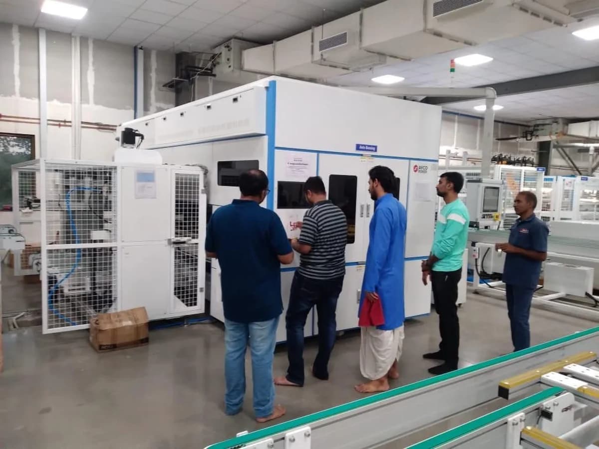 The team at the auto-bussing machine